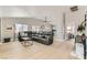 Spacious living room with hardwood floors, modern furniture, and an open layout at 4507 Grotto Ct, North Las Vegas, NV 89031