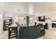 Open living room features modern furnishings, a large TV, and sliding glass door to backyard at 4507 Grotto Ct, North Las Vegas, NV 89031
