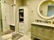 Bright bathroom showcasing modern vanity with sleek fixtures and tiled walk-in shower at 502 E Fairway Rd, Henderson, NV 89015