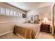 Cozy bedroom with neutral tones and comfortable furnishings at 502 E Fairway Rd, Henderson, NV 89015