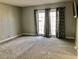 Spacious bedroom featuring neutral-toned walls and plush carpeting at 502 E Fairway Rd, Henderson, NV 89015