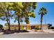 Attractive single-story house with mature landscaping, and a well-maintained front yard at 502 E Fairway Rd, Henderson, NV 89015