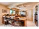 Modern kitchen with granite countertops, stainless steel appliances, and barstool seating at 502 E Fairway Rd, Henderson, NV 89015