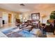 Comfortable living room showcasing stylish furniture, including a leather sofa and patterned rug at 502 E Fairway Rd, Henderson, NV 89015