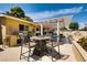 A covered outdoor patio area with dining furniture at 502 E Fairway Rd, Henderson, NV 89015
