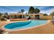 Inviting backyard pool with a relaxing hot tub and covered patio area, perfect for outdoor enjoyment at 502 E Fairway Rd, Henderson, NV 89015