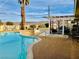 A serene backyard pool with a covered patio and mountain views at 502 E Fairway Rd, Henderson, NV 89015