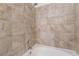 Close-up of the shower-tub combo with neutral tile surround at 515 Kristin Ln, Henderson, NV 89011