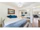 Comfortable bedroom featuring a large bed and mirrored closet doors at 515 Kristin Ln, Henderson, NV 89011