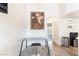 Bright dining area featuring a modern glass table and a view to the hallway at 515 Kristin Ln, Henderson, NV 89011