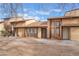 Inviting exterior view of a multi-unit home with well-kept landscaping at 515 Kristin Ln, Henderson, NV 89011