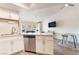 Updated kitchen open to the living area featuring stainless steel appliances and ample storage at 515 Kristin Ln, Henderson, NV 89011