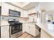 Updated kitchen with stainless steel appliances, and bright open floorplan at 515 Kristin Ln, Henderson, NV 89011