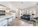 Cozy living room with natural light, breakfast bar, and comfortable seating arrangement at 515 Kristin Ln, Henderson, NV 89011