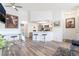 Bright living room featuring sleek floors, modern furnishings, and an open layout to the kitchen at 515 Kristin Ln, Henderson, NV 89011