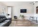 Inviting living room featuring modern decor and a comfortable black leather sofa at 515 Kristin Ln, Henderson, NV 89011
