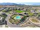 Attractive aerial view of a community featuring a pool, clubhouse, and landscaped common areas at 5155 Rock Daisy Dr, Las Vegas, NV 89135