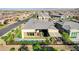 An aerial perspective displays a property's lush backyard with its inviting pool and stylish outdoor dining area at 5155 Rock Daisy Dr, Las Vegas, NV 89135