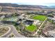 Great aerial view showcasing community amenities and green spaces in a modern desert neighborhood at 5155 Rock Daisy Dr, Las Vegas, NV 89135