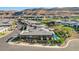 Expansive aerial view of a modern home with a private pool nestled in a scenic, upscale community at 5155 Rock Daisy Dr, Las Vegas, NV 89135