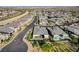 High-angle view of upscale community and home featuring a pool, manicured landscaping and modern design at 5155 Rock Daisy Dr, Las Vegas, NV 89135