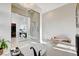 Bright bathroom featuring a modern tub, glass shower and stunning chandelier lighting at 5155 Rock Daisy Dr, Las Vegas, NV 89135