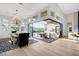 Elegant dining area seamlessly connects indoor and outdoor living spaces with floor to ceiling glass doors at 5155 Rock Daisy Dr, Las Vegas, NV 89135