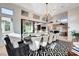Beautiful dining room with an elegant chandelier and an open floor plan leading to the kitchen at 5155 Rock Daisy Dr, Las Vegas, NV 89135