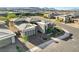 A modern home exterior featuring clean lines, a three car garage, and landscaped front yard at 5155 Rock Daisy Dr, Las Vegas, NV 89135