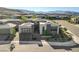 This modern home exterior features clean lines, a two car garage, and landscaped front yard at 5155 Rock Daisy Dr, Las Vegas, NV 89135