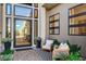 Inviting front porch with seating, plants, and a stylish front door at 5155 Rock Daisy Dr, Las Vegas, NV 89135