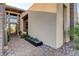 A contemporary home's front entryway with stone accents and modern landscaping at 5155 Rock Daisy Dr, Las Vegas, NV 89135