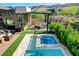 Inviting hot tub with outdoor kitchen, providing a luxurious and relaxing experience in a private yard at 5155 Rock Daisy Dr, Las Vegas, NV 89135