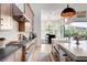 Modern kitchen with stainless steel appliances, a large island, and an open layout, perfect for cooking and entertaining at 5155 Rock Daisy Dr, Las Vegas, NV 89135
