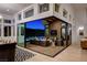 Modern indoor-outdoor living space with seamless transition to patio, perfect for entertaining and relaxation at 5155 Rock Daisy Dr, Las Vegas, NV 89135