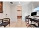 Office space with desk, chair, and view into well-stocked pantry and exterior at 5155 Rock Daisy Dr, Las Vegas, NV 89135