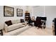Cozy home office featuring a comfortable sofa, desk setup, and natural light at 5155 Rock Daisy Dr, Las Vegas, NV 89135