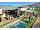 Beautiful outdoor patio area with a covered grill station, fireplace and comfortable seating at 5155 Rock Daisy Dr, Las Vegas, NV 89135