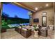 Relaxing patio area with comfortable seating around a fire pit, ideal for outdoor gatherings and cozy evenings at 5155 Rock Daisy Dr, Las Vegas, NV 89135