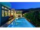 Gorgeous backyard with a luxurious pool, spa, and covered patio area for outdoor entertaining at 5155 Rock Daisy Dr, Las Vegas, NV 89135