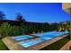 Inviting pool and spa with a waterfall feature, surrounded by lush landscaping, perfect for relaxation and recreation at 5155 Rock Daisy Dr, Las Vegas, NV 89135