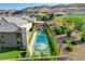 Stunning backyard pool area with lounge, spa, and lush landscaping, perfect for relaxation and entertaining at 5155 Rock Daisy Dr, Las Vegas, NV 89135