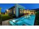 Beautifully lit pool and spa with chaise lounges, highlighting the home's outdoor living space at 5155 Rock Daisy Dr, Las Vegas, NV 89135