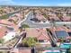 Single story home featuring a terracotta tile roof with a lush backyard and covered patio area at 5513 Escallonia St, Las Vegas, NV 89149