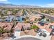 A charming single-story home with a terracotta roof is surrounded by lush landscaping and mature trees at 5513 Escallonia St, Las Vegas, NV 89149