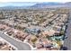 Located in a vibrant community, this single-story home features a terracotta tile roof and lush greenery at 5513 Escallonia St, Las Vegas, NV 89149