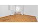 Bedroom featuring parquet flooring and double door access at 5513 Escallonia St, Las Vegas, NV 89149