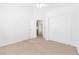 Bright bedroom with ceiling fan, closet, and entry door at 5513 Escallonia St, Las Vegas, NV 89149