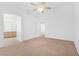 Bright bedroom with ceiling fan, ensuite bathroom, and walk-in closet at 5513 Escallonia St, Las Vegas, NV 89149