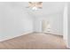 Bright bedroom with ceiling fan and patio door at 5513 Escallonia St, Las Vegas, NV 89149